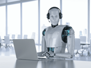 robot at desk with laptop