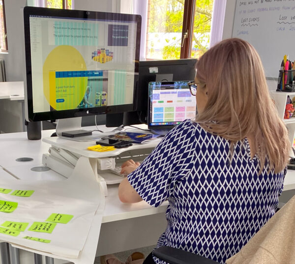extramile hq web designer at desk