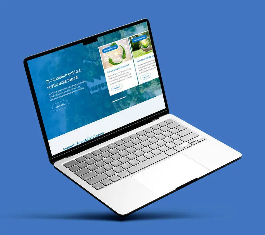Open laptop on a blue background displaying NCH Europe website