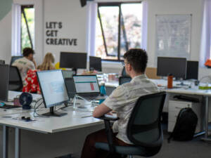 Extramile Digital professionals collaborating on a B2B marketing campaign