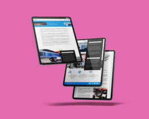 Three tablet devices on a pink background, displaying various webpages from the Print Designs website.