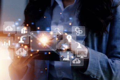 Close up of lady in a suit, hands holding a tablet, with a graphic overlay that represents digital and technology marketing
